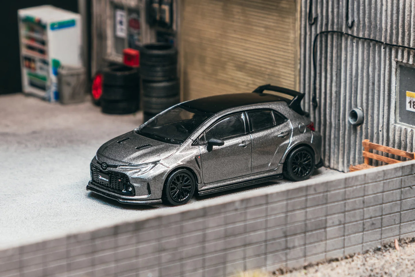 Tarmac Works 1/64 - Toyota GGR Corolla Grey With Oil Can Packaging - GLOBAL64